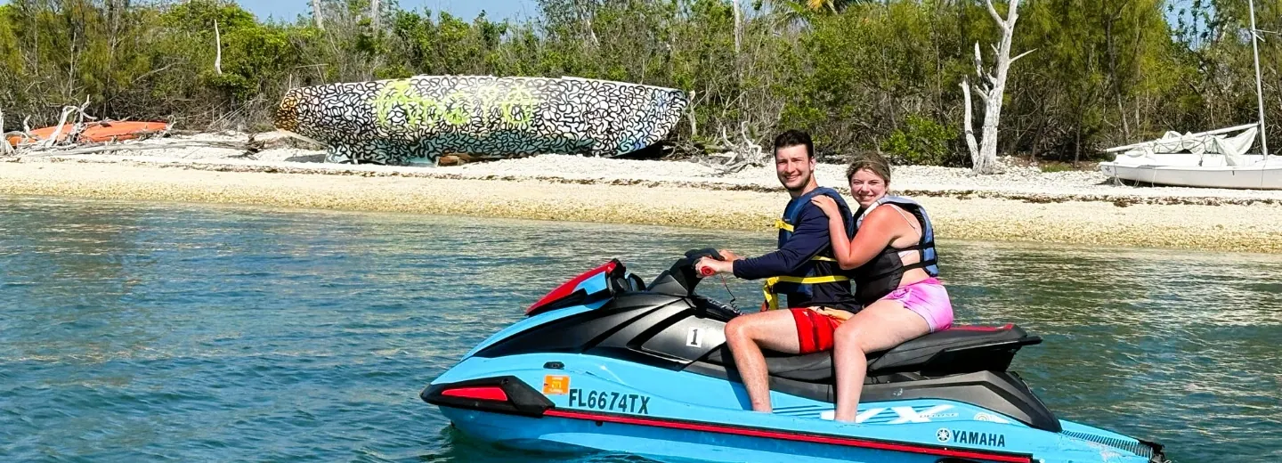 Guests riding a Yamaha WaveRunner on a guided Key West jet ski tour departing from Perry Hotel & Marina